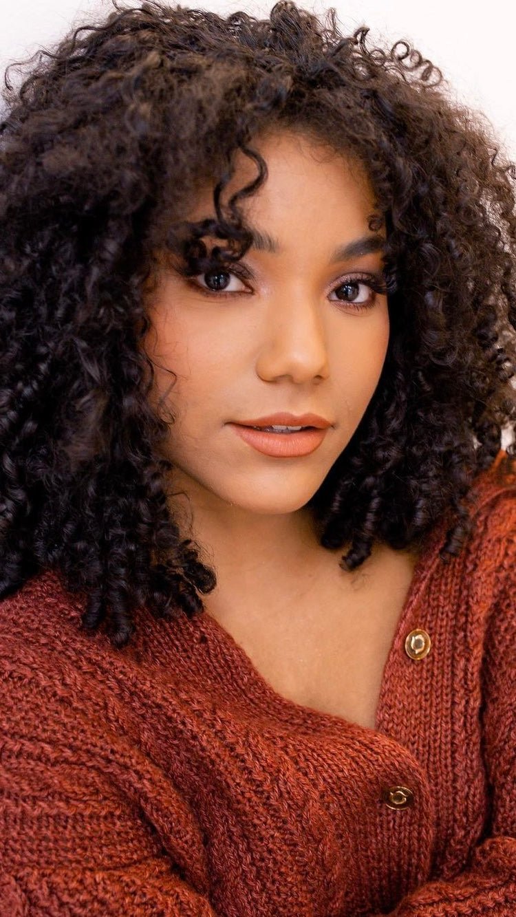 Model wearing The MATTERfying Foundation in Shade 10 Bliss, showcasing a flawless matte finish. Her medium olive skin with warm undertones appears smooth, even, and naturally radiant, highlighting the foundation’s skin-blurring and full-coverage effect