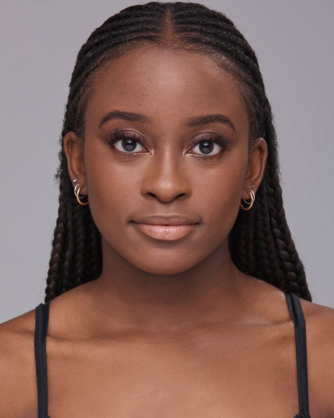 Model wearing The MATTERfying Foundation in Shade 20 Captivate, showcasing a flawless matte finish. Her complexion appears smooth, even, and pore-blurred, highlighting the foundation’s full coverage and natural look